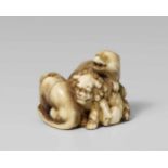 A rare Edo school ivory okimono-type netsuke of a shishi, a tiger and a bear, by Tomochika. Second