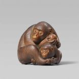A large okimono-type boxwood netsuke of a monkey and young. Late 19th centurySitting with head