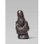 A wood netsuke of Fukurokuju, by Tamahiko. 19th centuryStanding with hands covered by his long robe,