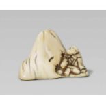 An ivory netsuke of Saigyô Hôshi admiring Mount Fuji. Early 19th centurySitting with a bundle tied