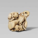 An ivory netsuke of three playing rats. First half 19th centuryThe mother rat sits at the centre