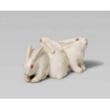 An attractive ivory netsuke of three rabbits. Mid-19th centurySeated close together with heads