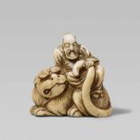 A small ivory netsuke possibly of Bunkan Zenshi. Early 19th centuryWith eyes closed and seated at