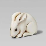 A fine ivory netsuke of a rabbit. 19th centurySeated with head lowered and paws placed close
