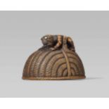 An amusing wood netsuke of an oni and Shôki, by Chikusai. Second half 19th centuryA long-haired