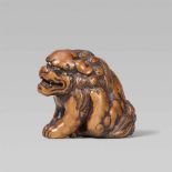 A good large boxwood netsuke of a shishi. Late 18th/early 19th centurySeated with forepaws placed