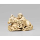 An ivory netsuke of a warrior on horseback. 19th centuryRiding through waves and tightly holding