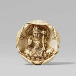 A unusual netsuke of Kannon Bosatsu. Late 19th centurySeated in meditation on a lotus throne, a