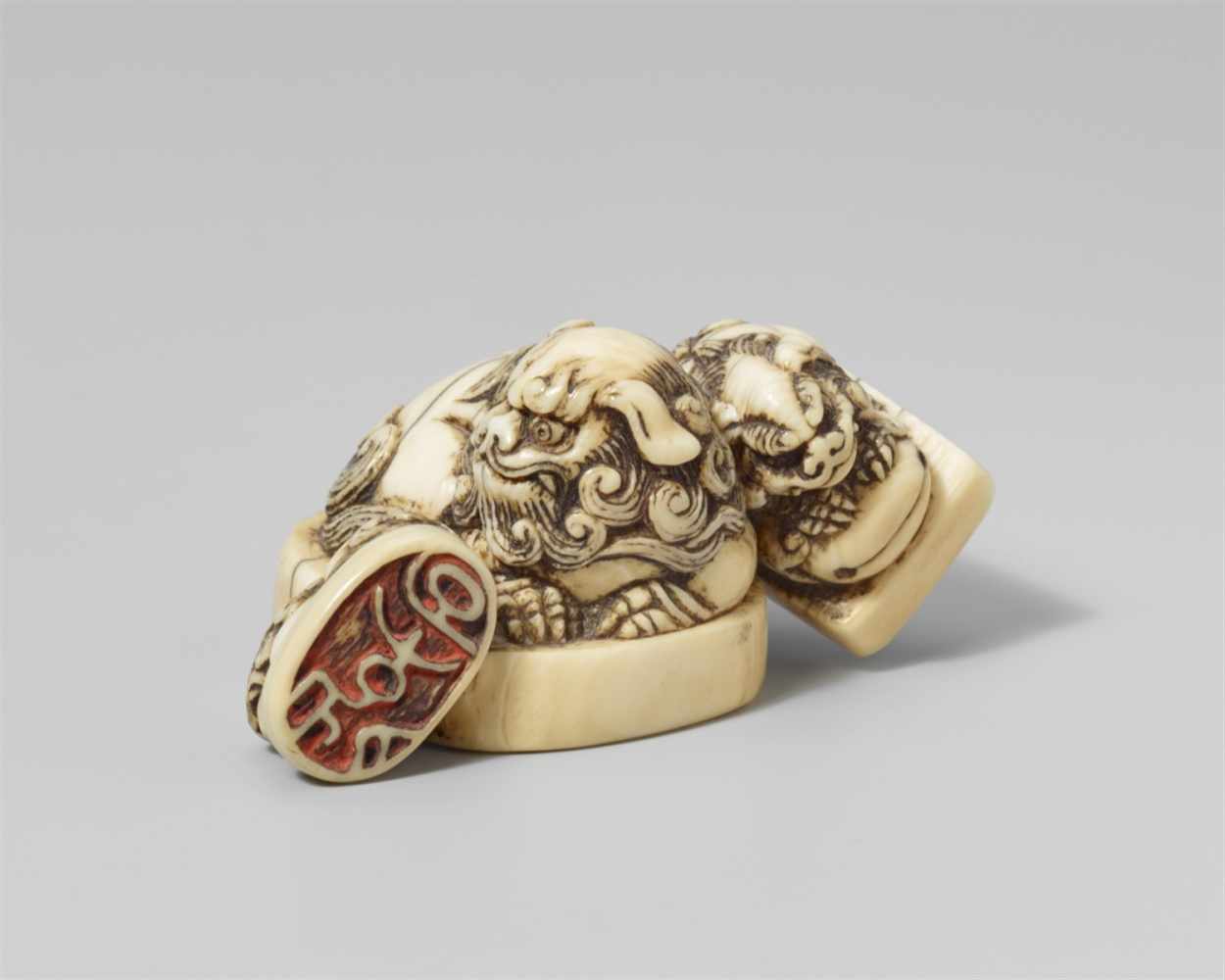 An ivory netsuke of a group of three seals. Mid-19th centuryAll seal knobs carved in shape of a