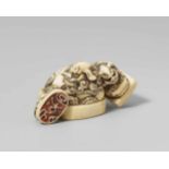 An ivory netsuke of a group of three seals. Mid-19th centuryAll seal knobs carved in shape of a