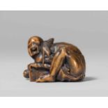 A small boxwood netsuke of a disappointed rat catcher, by Ichimin. Mid-19th centuryCrouching over