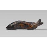 A fine and rare umimatsu netsuke of a fish, probably a carp. 19th centurySwimming, the scaly body