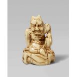 An unusual ivory netsuke of a large oni. 18th centurySeated with a fierce expression and big horns