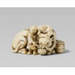 A good ivory netsuke of a recumbent ox and herd boy. Early 19th centuryLying with legs folded