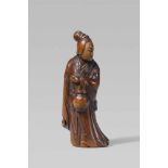 A good boxwood netsuke of a servant of Seiôbô. 18th centuryStanding turned to the right and