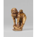 A boxwood okimono-type netsuke of a rat catcher. Late 19th centuryStanding wearing only a fundoshi