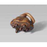 A boxwood netsuke of a lotus pod. 19th centuryWith seven openings and six loose seeds, the curved
