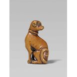 An attractive boxwood netsuke of a dog. Early 19th centurySitting on its hind legs with its head