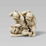 An amusing Edo school ivory netsuke of three oni at setsubun, by Gyokkôsai. Mid-19th