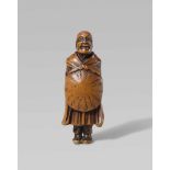 A boxwood netsuke of Saigyô Hôshi. First half 19th centuryStanding with head slightly raised, a