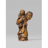 A boxwood netsuke of a Dutchman with a child. Early 19th centurySlightly bent forward under the