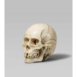 A very fine and highly realistic ivory model of a skull, by Toshinaga. Late 19th centuryThe human