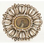 Gold and seed pearl pendant. 18th century. In the centre is a miniature on parchment [...]