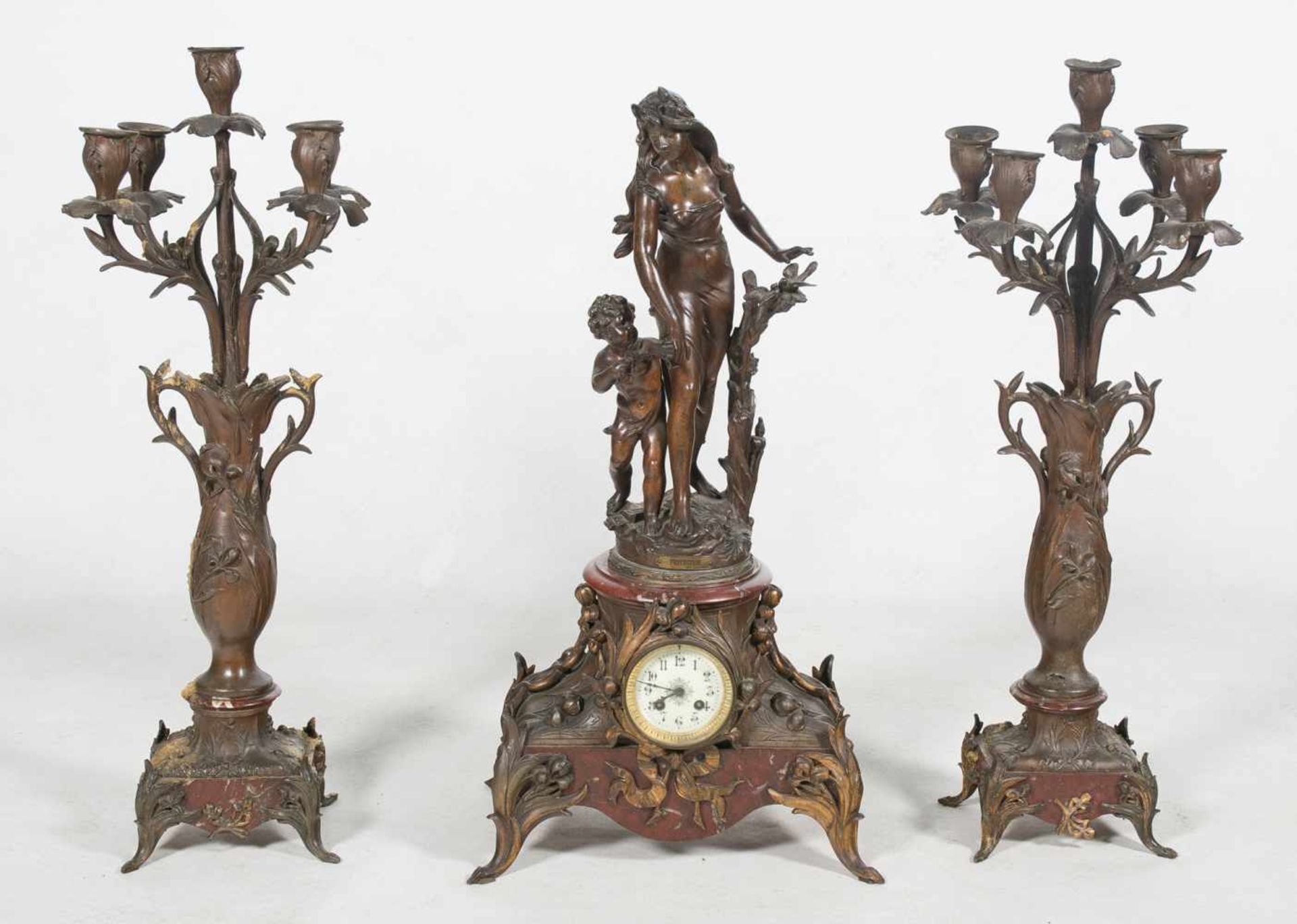 Large decorative set of clock and pair of candelabras. Art Nouveau. France. Circa 1900. Clock heigh: