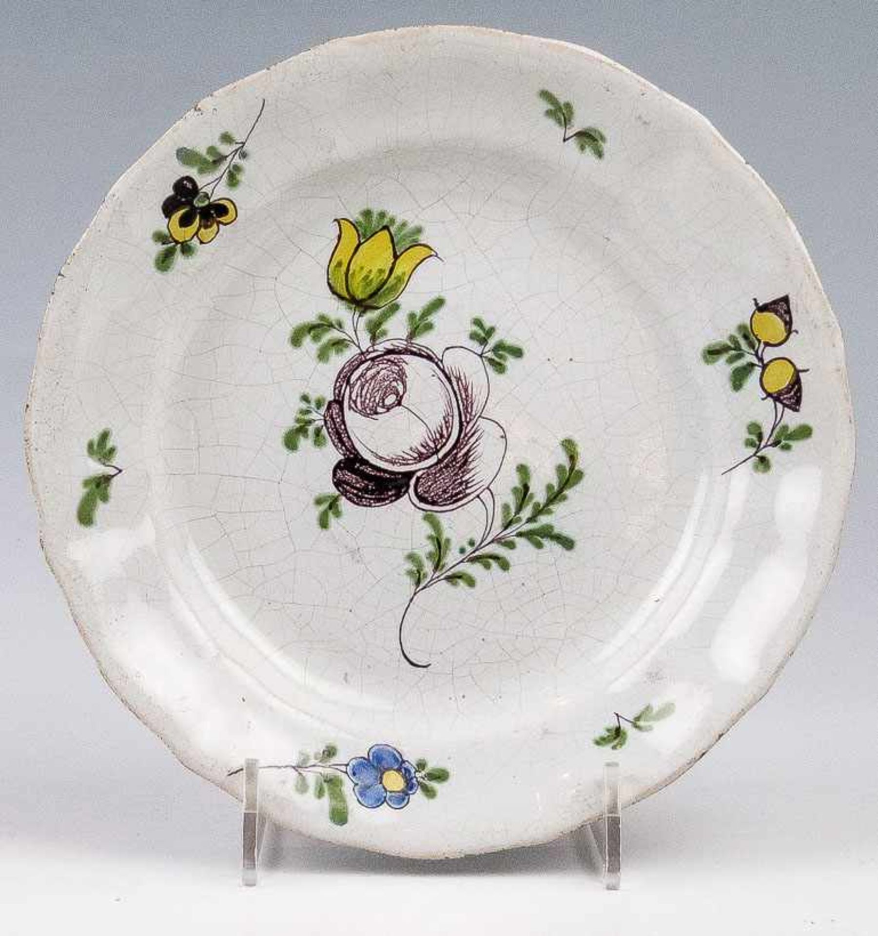 Teller.Wohl Proskau, um 1780/90.Fayence. Weiße, krakelierte Glasur mit Bemalung in Gelb, Mangan,