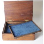 Antique wooden case with brass catch, containing four trays and a base level lined with blue