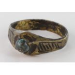 Medieval gilt bronze Stirrup ring, with stone in bezel. 13th century