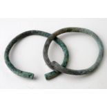 Medieval Period, Viking (ca. 900 - 1100 AD) pair of bronze bracelet with stylized dragon heads;