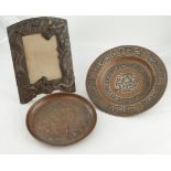 Two Middle Eastern bronze dishes (one with silver inlay), diameter 22.5cm & smaller, together with a