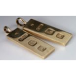 Two 9ct gold ingots with pendant mount attached, both hallmarked Birmingham 1977. Total weight 34.