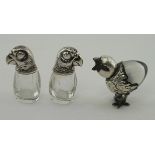 Three silver and glass peppers, the two parrots are marked 800 and the damaged chick is unmarked