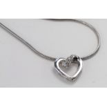 9ct White Gold Floating Heart Diamond Pendant on a 16 inch chain weight 5.1g