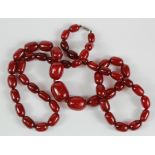 Cherry amber necklace, consisting of fifty-one graduating beads, length 89cm approx.