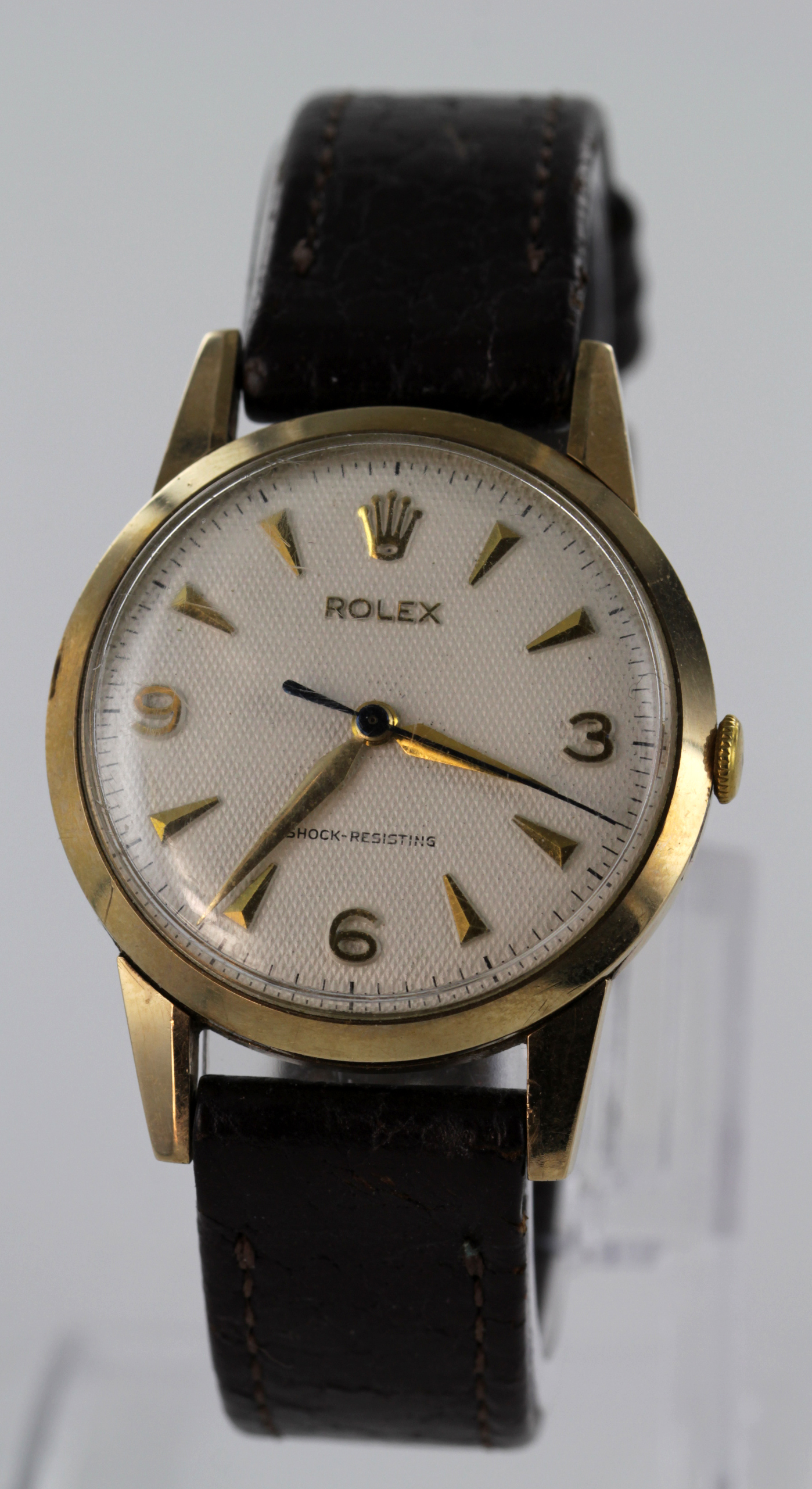 Gents 9ct cased Rolex wristwatch, the case hallmarked Edinburgh 1959. The cream dial with gilt baton