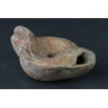 Ancient Roman (ca. 200 AD) terracotta oil lamp with decoration; star depicted on top - possibly