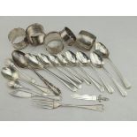 Silver. A collection of silver flatware and napkin rings, total weight 9.5 oz approx.