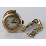 Ladies 9ct Gold cased wristwatch by J. W. Benson, on a rolled gold bracelet, dial diameter 18mm