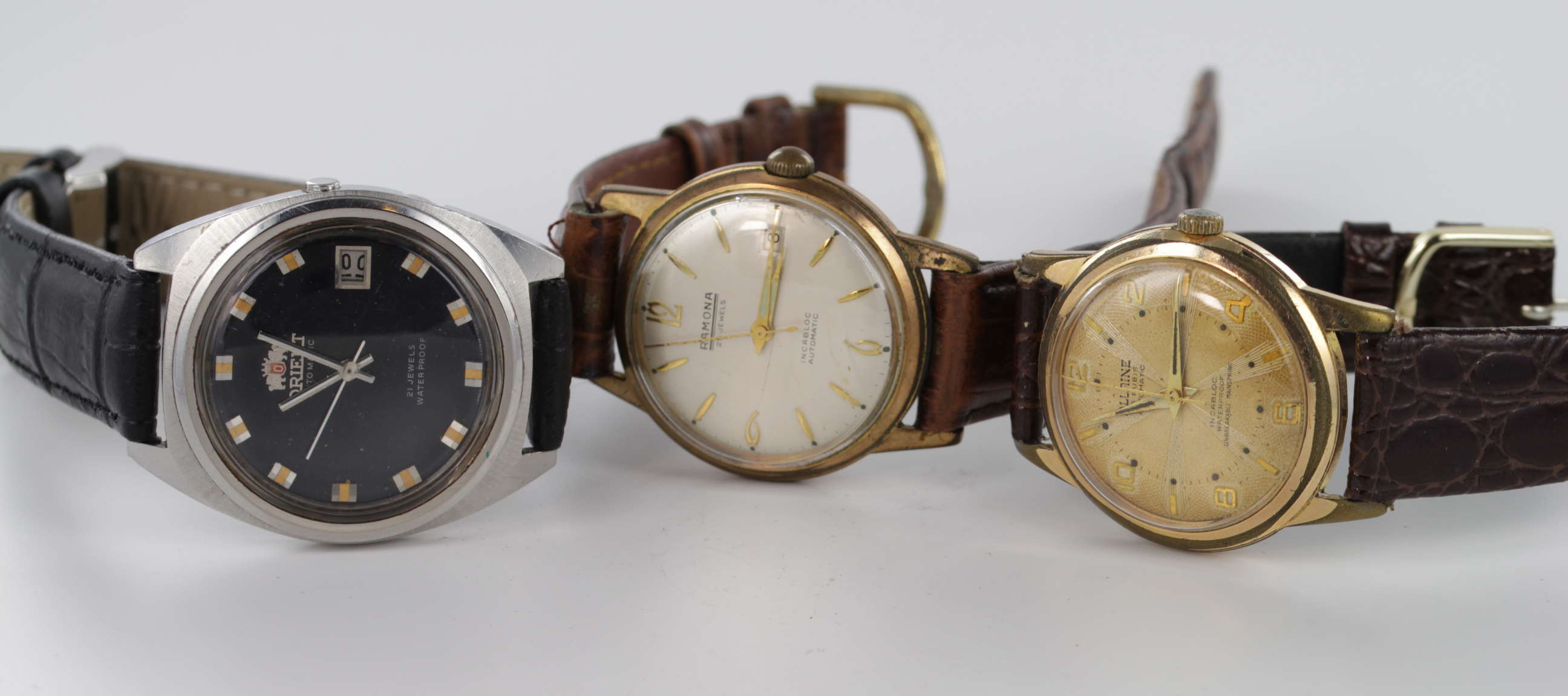 Three gents automatic wristwatches by Romana, Allaine & Orient. All working when catalogued