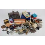 Miscellanea. A collection of miscellaneous items including compacts, coin holders, tape measures,