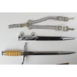 Dagger: an East German NVA. Dress Dagger with hanging straps & buckles. Blade 9.75" numbered '6799'.