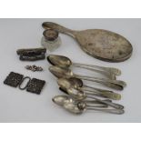 Silver. A collection of mixed silver, including spoons, belt buckle, mirror, brooch etc., some