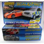 Scalextric. Three Scalextric boxed sets, comprising Street Pursuit; Monster Truck Mayhem!; Drift