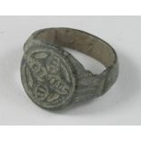 Medieval Ring with Cross, ca. 1200 AD, oval shaped band, integral round bezel with cross motif. Very