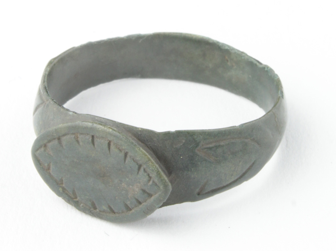 Viking Bronze Dragon Eye Ring, ca. 900 AD, round band with integral elliptical bezel depicting a