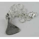 Viking Silver Axe Shape Pendant, ca. 900 AD, cast amulet shaped as battle axe with integal loop.