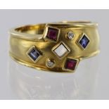 18ct yellow gold band ring set with sapphire, ruby and diamond, size M, weight 5.2g.